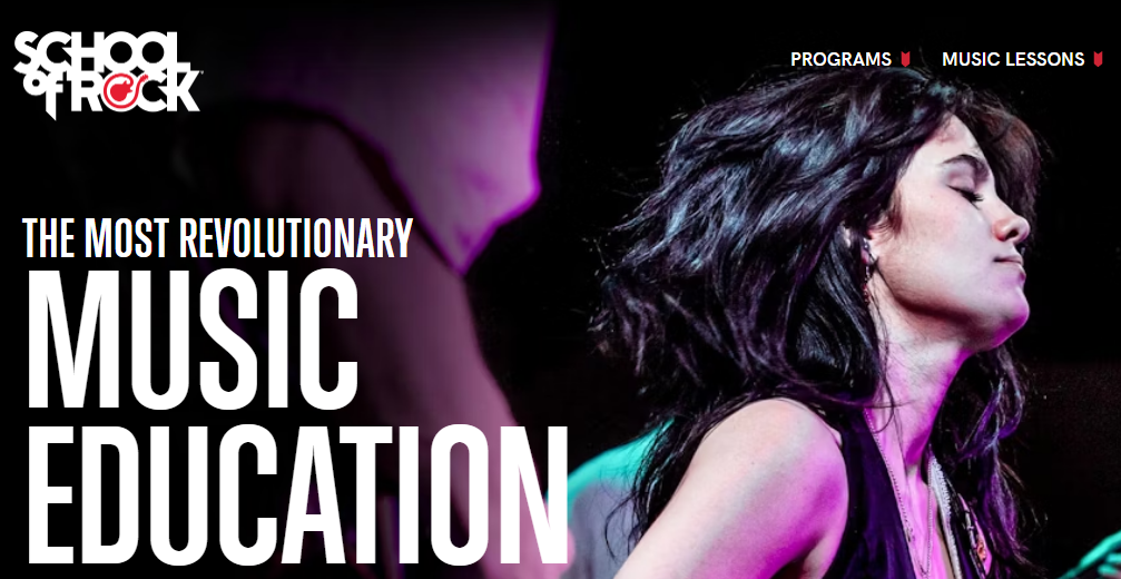 Image of a student learning to play music at School of Rock, a place for music lessons and live performances.